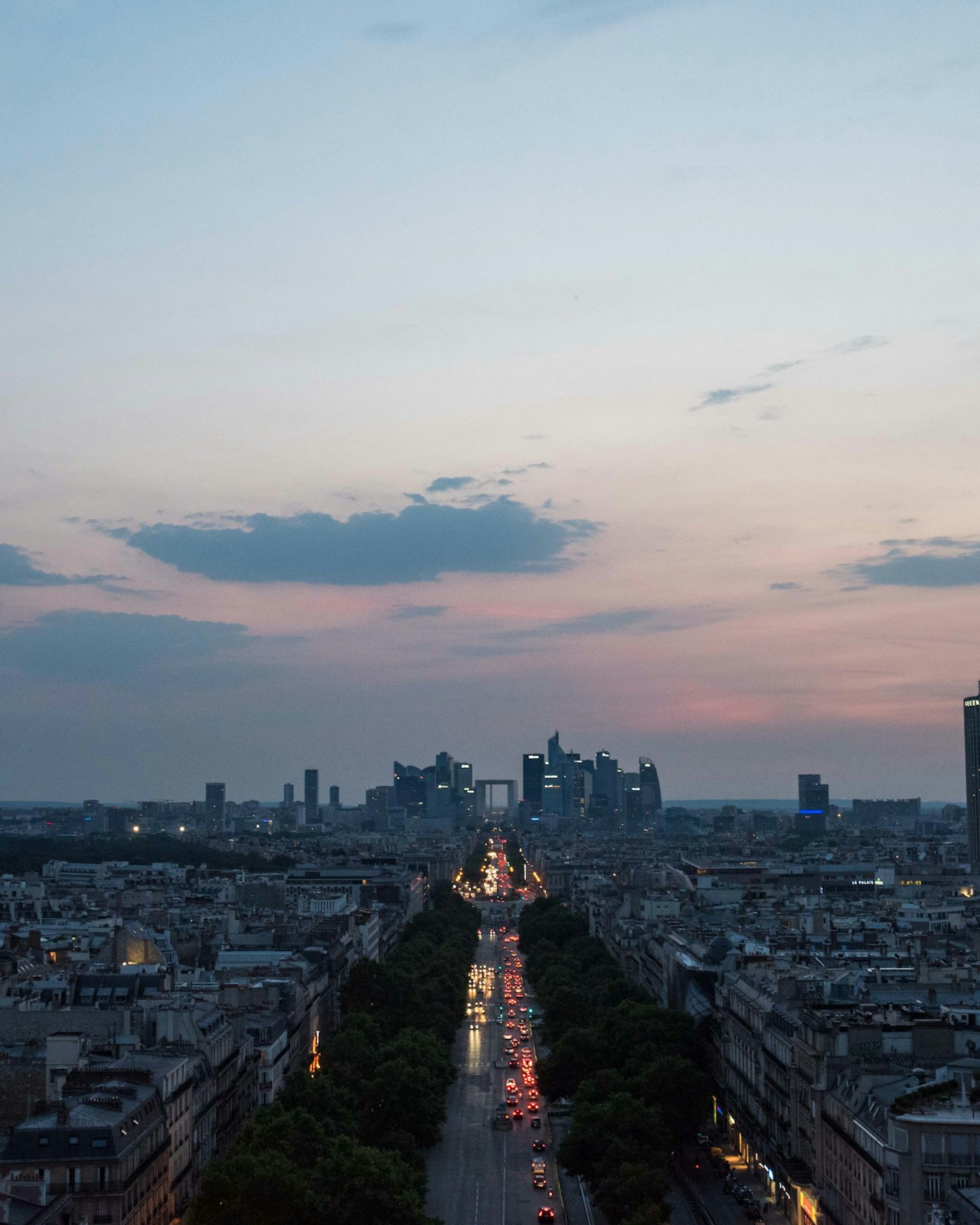 Friends on a Paris rooftop in the evening